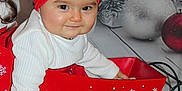 Leyna participe au concours pour gagner de l'argent avec cette photo : baby, child, red_bow, christmas, holiday, sleigh, decorations, ornaments, white_sweater, smiling, festive, indoor, floor, fur_rug, red, playful, cute, portrait, seasonal, celebration