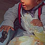 Karzoo is registered to the contest to win money with this photo: baby, bow_tie, boy, child, clothing, cute, face, hand, happy, indoor, person, play, portrait, seat, shirt, smiling, suspenders, toddler, toy, wrapping_paper