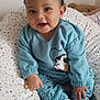 Alessio a rejoint le concours — aidez-le/la à gagner de superbes lots ! baby, child, blue_clothing, sitting, smiling, face, patterned_cushion, cartoon_character, socks, indoor, cute, happy, infant, soft_toys, bedroom, comfort, portrait, young_child, cozy, casual