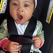 Nala joined the competition — help win amazing prizes! baby, car_seat, child, headband, pink, hands, safety_harness, yawning, surprised, cute, infant, clothing, blanket, seatbelt, portrait, person, face, indoors, expression, young