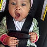 baby, car_seat, child, headband, pink, hands, safety_harness, yawning, surprised, cute, infant, clothing, blanket, seatbelt, portrait, person, face, indoors, expression, young