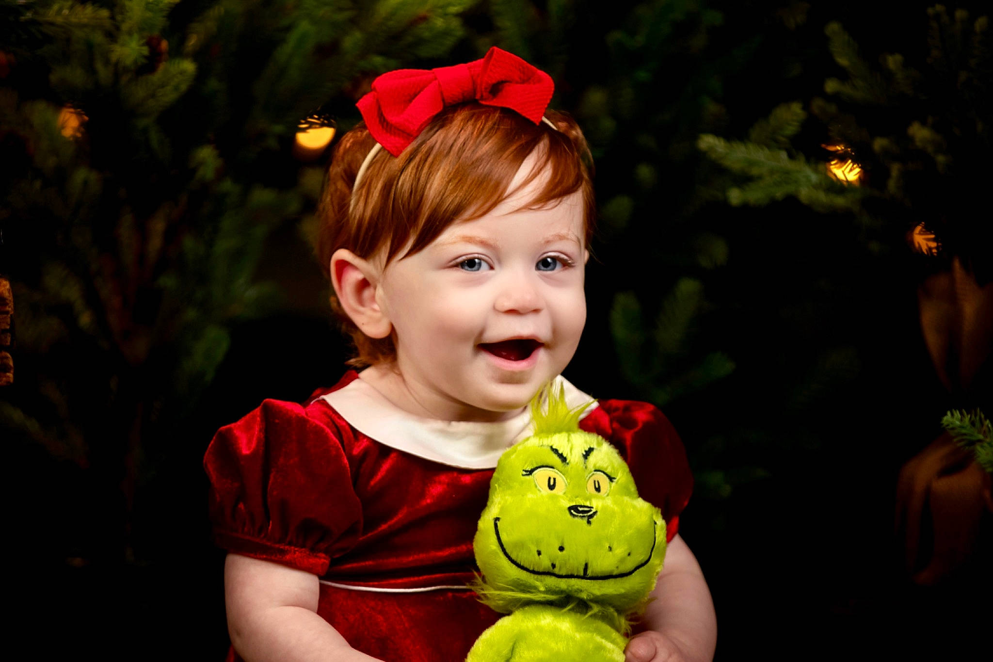 Georgia is registered to the contest to win money with this photo: baby, baby_toddler_clothing, child, christmas, christmas_decoration, christmas_eve, christmas_ornament, event, eye, facial_expression, flash_photography, fun, grass, happy, holiday, joy, mammal, person, plant, t_shirt