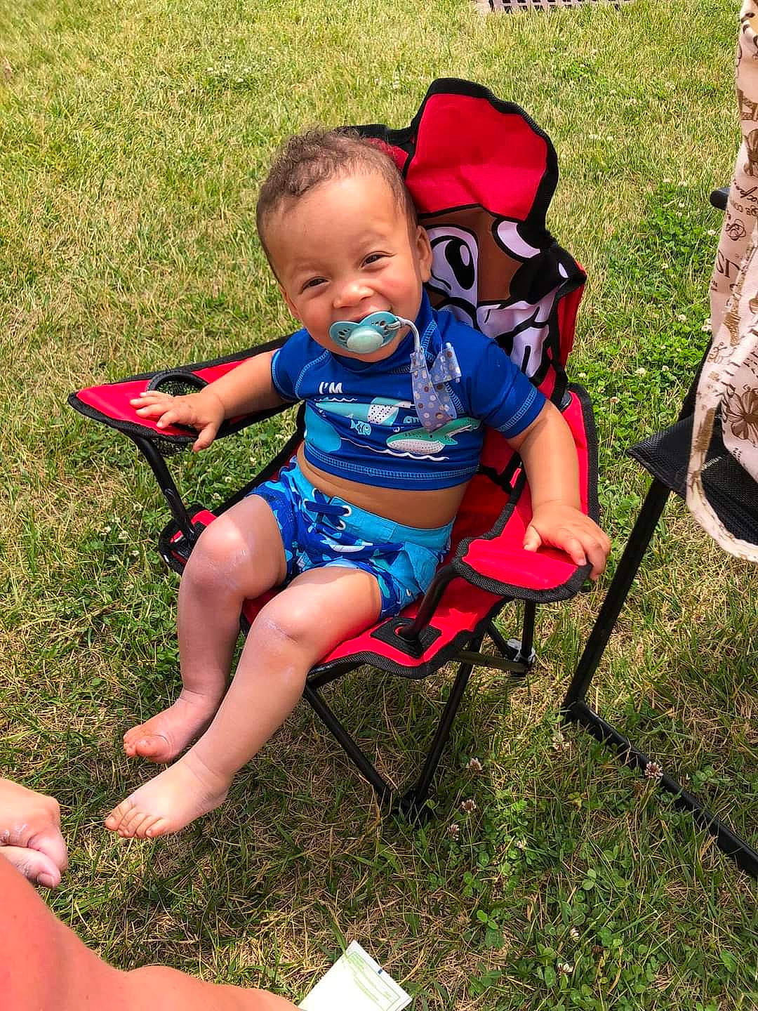 Arrow joined the competition — help win amazing prizes! baby, baby_toddler_clothing, chair, child, folding_chair, foot, fun, grass, happy, human_leg, lap, lawn, leisure, outdoor_furniture, people_in_nature, person, recreation, sitting, summer, thigh