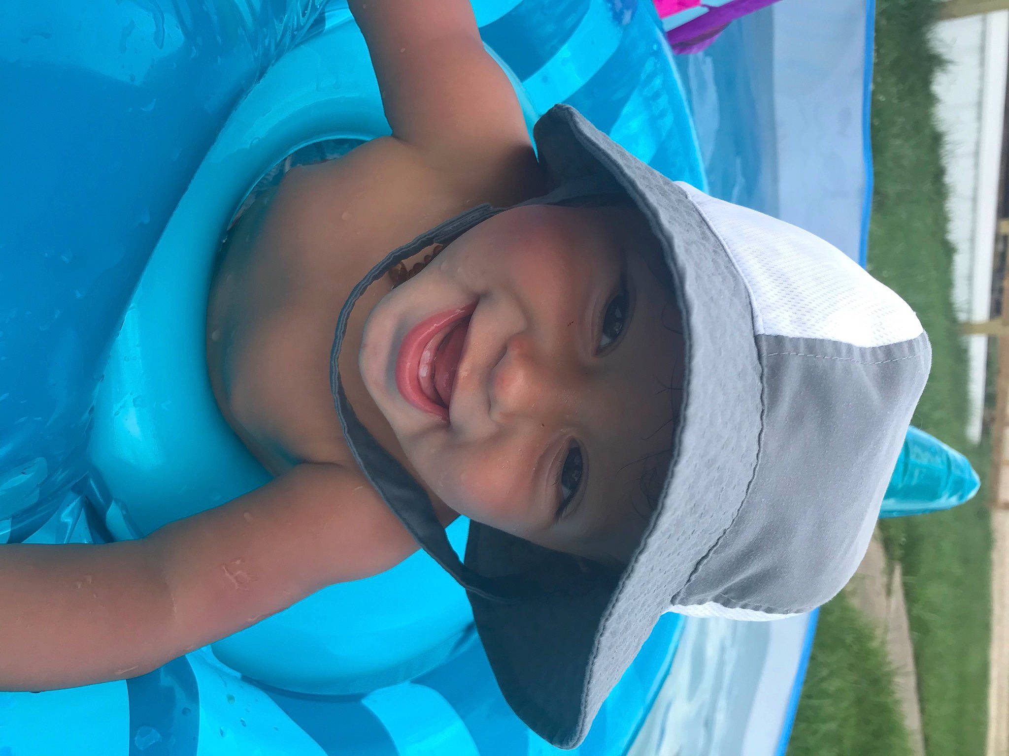 Derrick is registered to the contest to win money with this photo: aqua, beauty, blue, child, cool, eye, fun, happy, headgear, headwear, leisure, lip, mouth, neck, nose, person, skin, smile, summer, teal