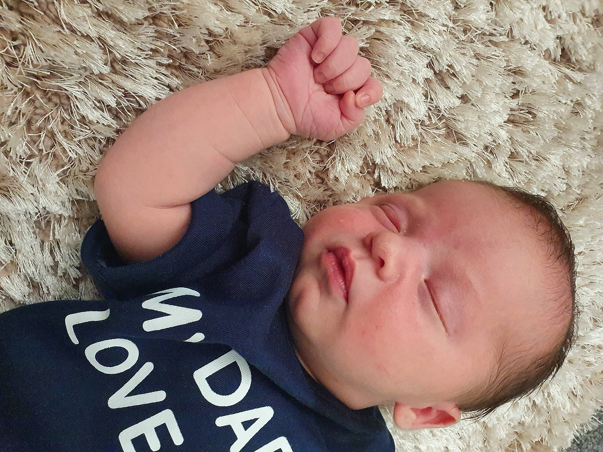 Lennie is registered to the contest to win money with this photo: arm, baby, cheek, chin, comfort, eye, eyelash, face, finger, gesture, happy, head, lip, mouth, nose, organ, person, skin, toddler, tree