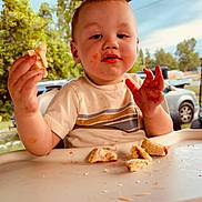 Kolby joined the competition — help win amazing prizes! toddler, child, messy, food, sandwich, highchair, outdoor, patio, face, hands, sauce, tray, trees, car, shirt, expression, daylight, baby, clothing, person