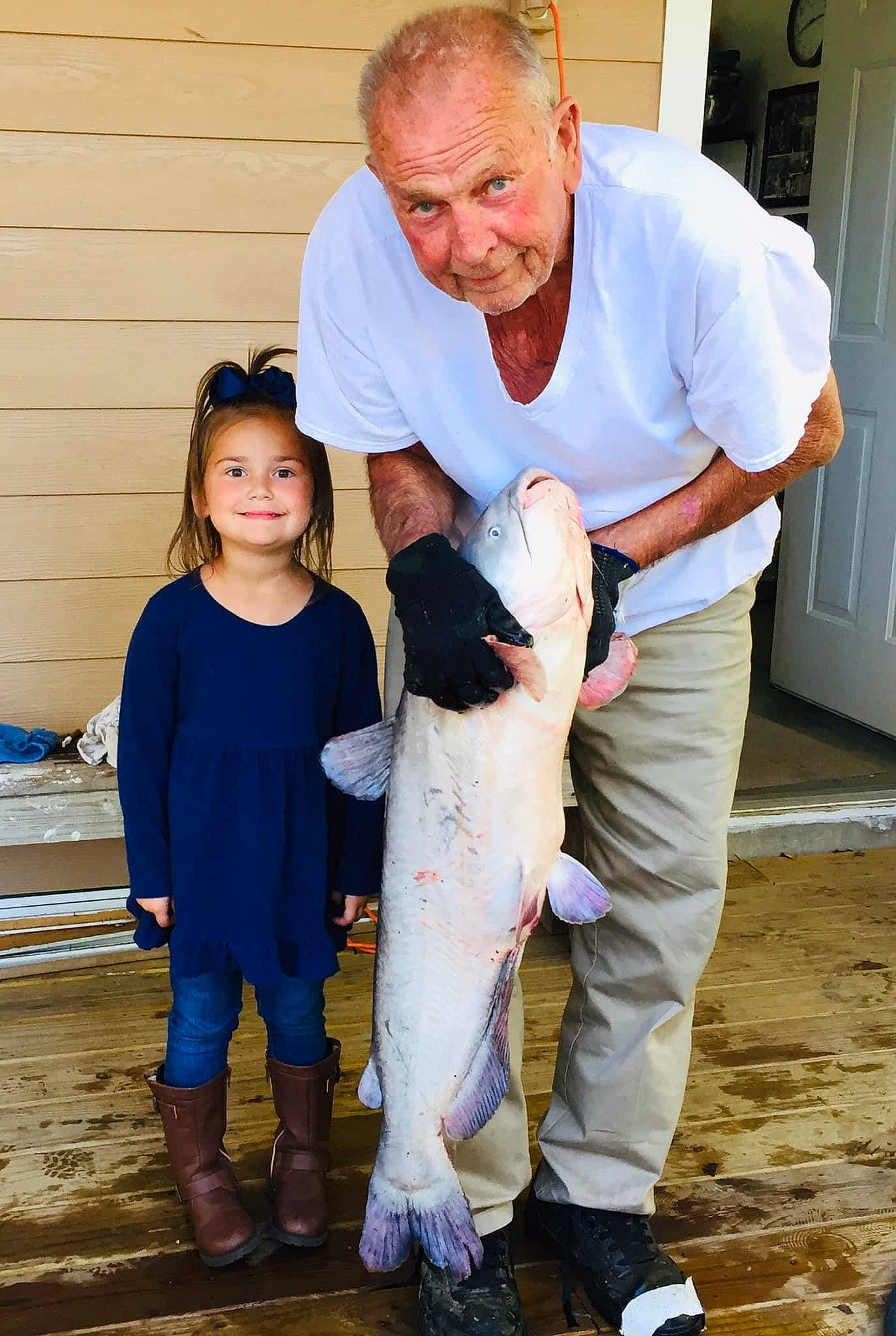 Preslie is registered to the contest to win money with this photo: belt, canidae, child, companion_dog, dog_breed, event, face, fawn, fish, flooring, fun, fur, gesture, happy, joy, person, shoe, smile, sneakers, sporting_group