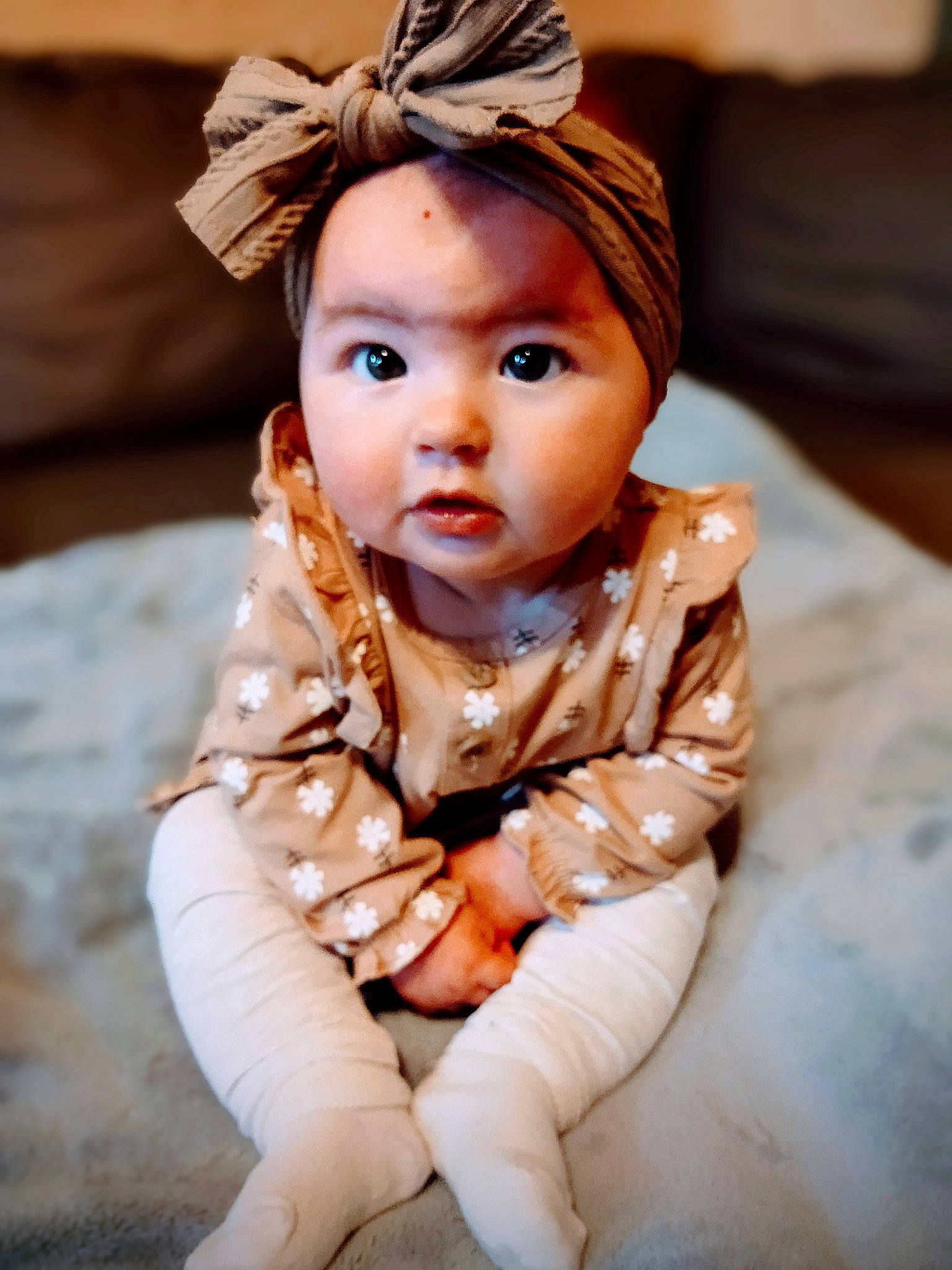 Sadie is registered to the contest to win money with this photo: baby, baby_toddler_clothing, cheek, child, chin, eye, face, flash_photography, happy, head, headgear, headpiece, human, iris, mammal, person, sitting, skin, sleeve, textile