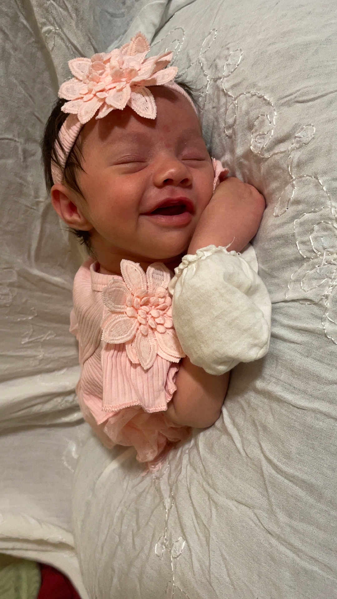 Xiomarrah joined the competition — help win amazing prizes! baby, infant, smiling, headband, flower, pink_clothing, sleeping, resting, cushion, white_fabric, cute, child, soft_texture, portrait, indoors, peaceful, closeup, newborn, hand, face