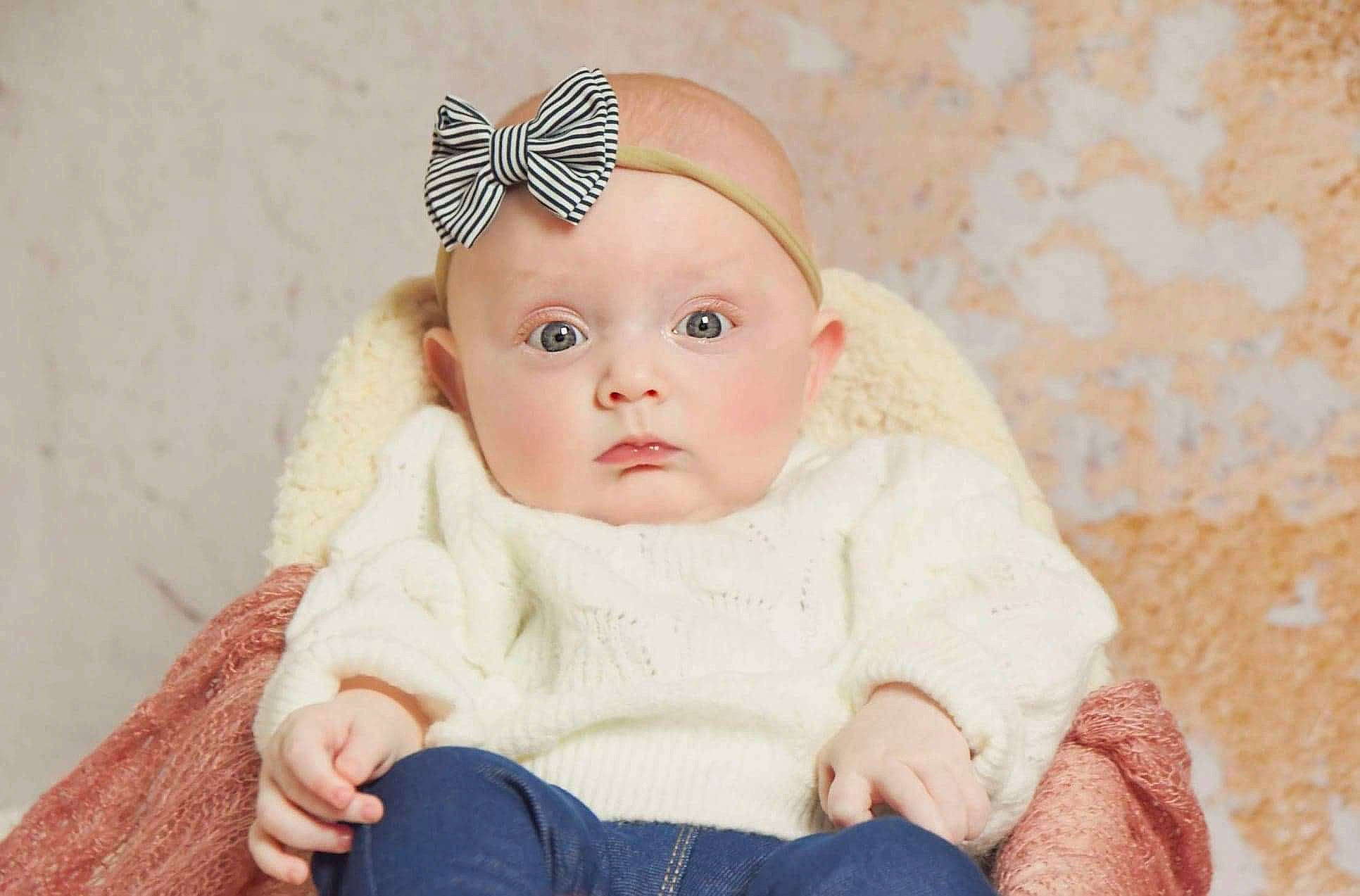 Inaya participe au concours pour gagner de l'argent avec cette photo : baby, baby_toddler_clothing, cap, cheek, chin, comfort, eye, eyebrow, eyelash, head, headband, headgear, headpiece, iris, knit_cap, lip, person, skin, sleeve, toddler