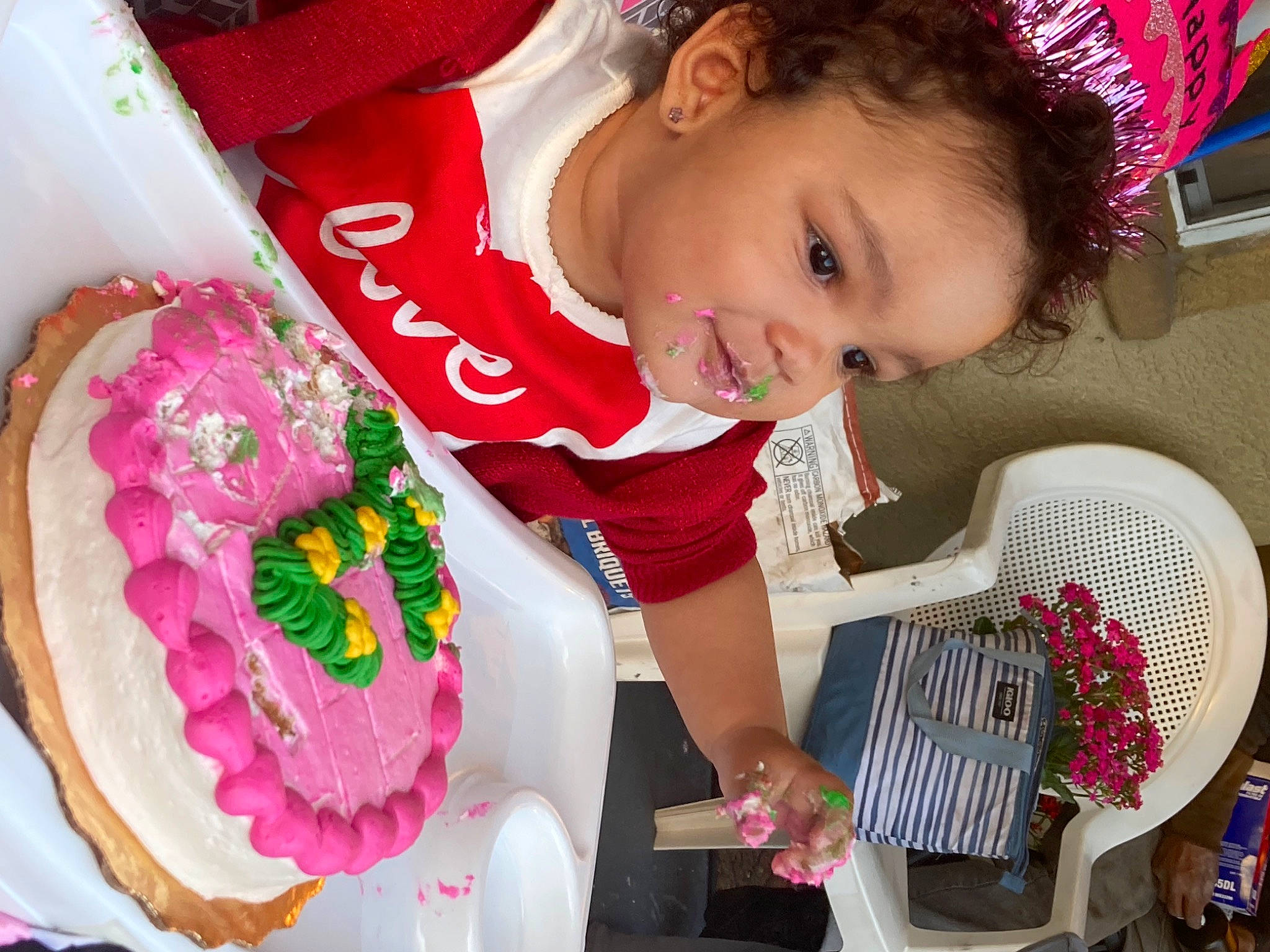 Maliki is registered to the contest to win money with this photo: baby_toddler_clothing, beauty, birthday_cake, cake_decorating, cake_decorating_supply, child, event, fun, happy, holiday, magenta, organ, person, pink, product, red, skin, smile, sweetness, textile