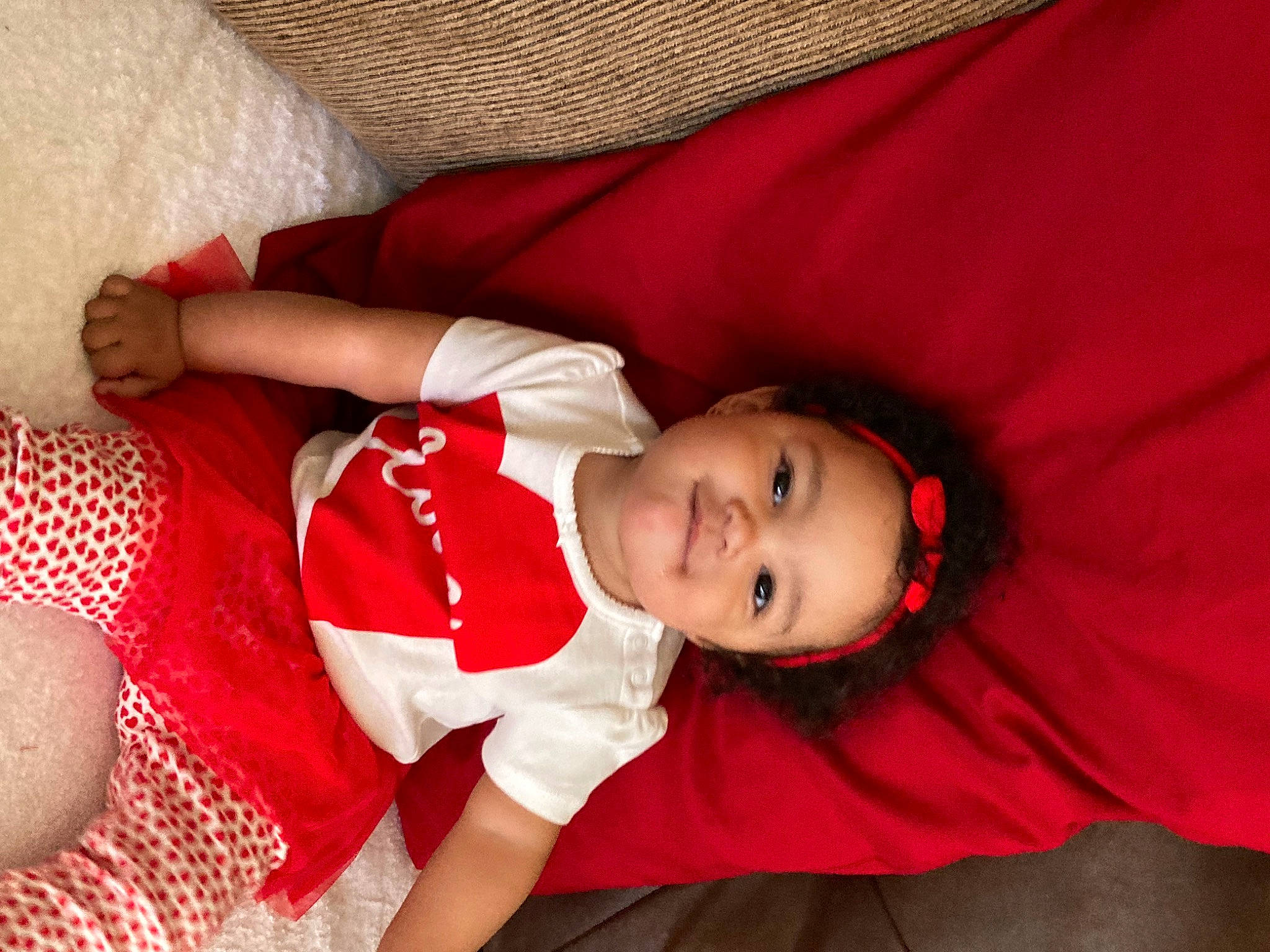 Maliki joined the competition — help win amazing prizes! baby, baby_toddler_clothing, carmine, child, comfort, finger, fun, happy, human_body, human_leg, joy, lip, mouth, pattern, person, red, skin, sleeve, smile, thigh