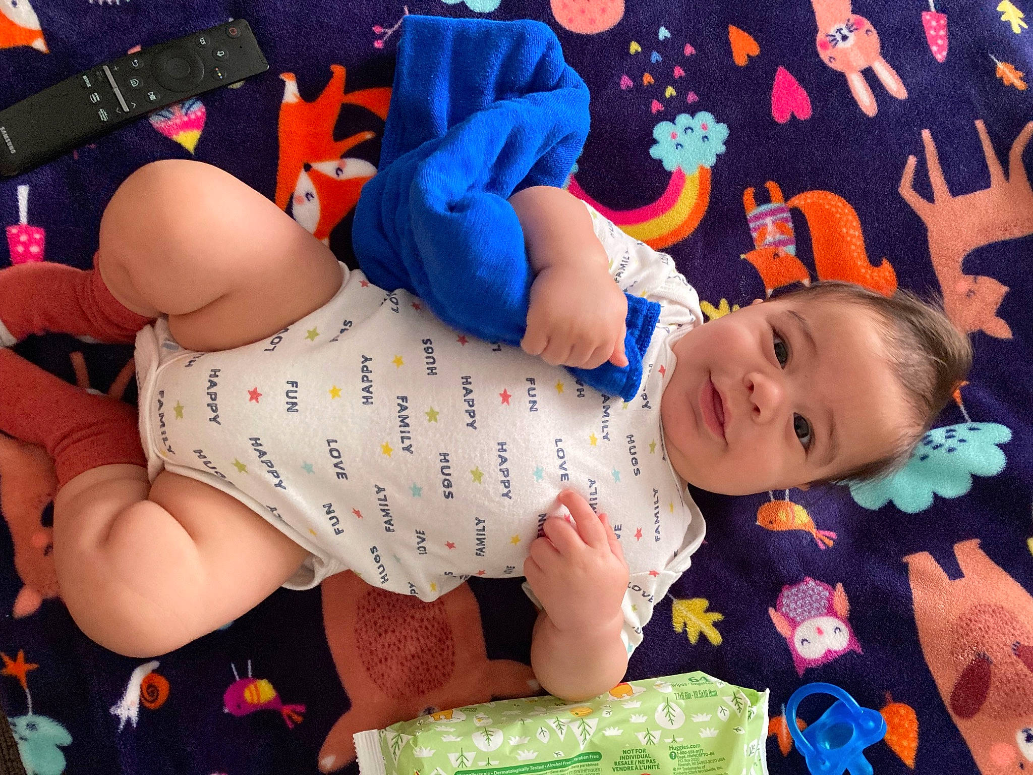 Vicente is registered to the contest to win money with this photo: arm, baby, baby_products, baby_toddler_clothing, child, comfort, electric_blue, finger, foot, fun, happy, human_body, human_leg, knee, leg, linens, pattern, person, sleeve, thigh