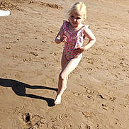 Kiara joined the competition — help win amazing prizes! child, beach, sand, water, ocean, swimsuit, barefoot, sunny, shadow, running, summer, recreation, outdoor, people, shoreline, play, vacation, holiday, fun, coast