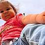 Rose participe au concours pour gagner de l'argent avec cette photo : child, toddler, baby, person, face, arm, pink_shirt, jeans, outdoor, sky, grass, hair, expression, closeup, portrait, casual_clothing, daylight, cute, reaching_hand, family