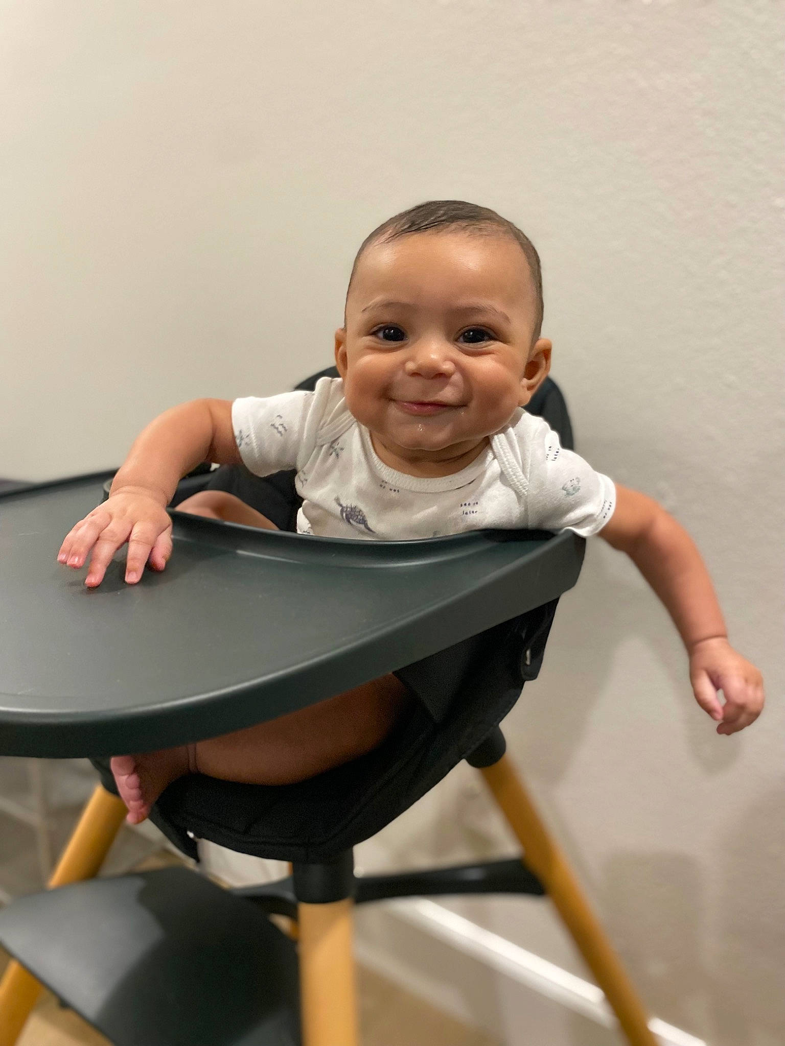 Zachary is registered to the contest to win money with this photo: baby, baby_toddler_clothing, balance, chair, child, comfort, elbow, face, fun, happy, human_body, joy, leisure, person, play, shorts, sitting, sleeve, smile, t_shirt