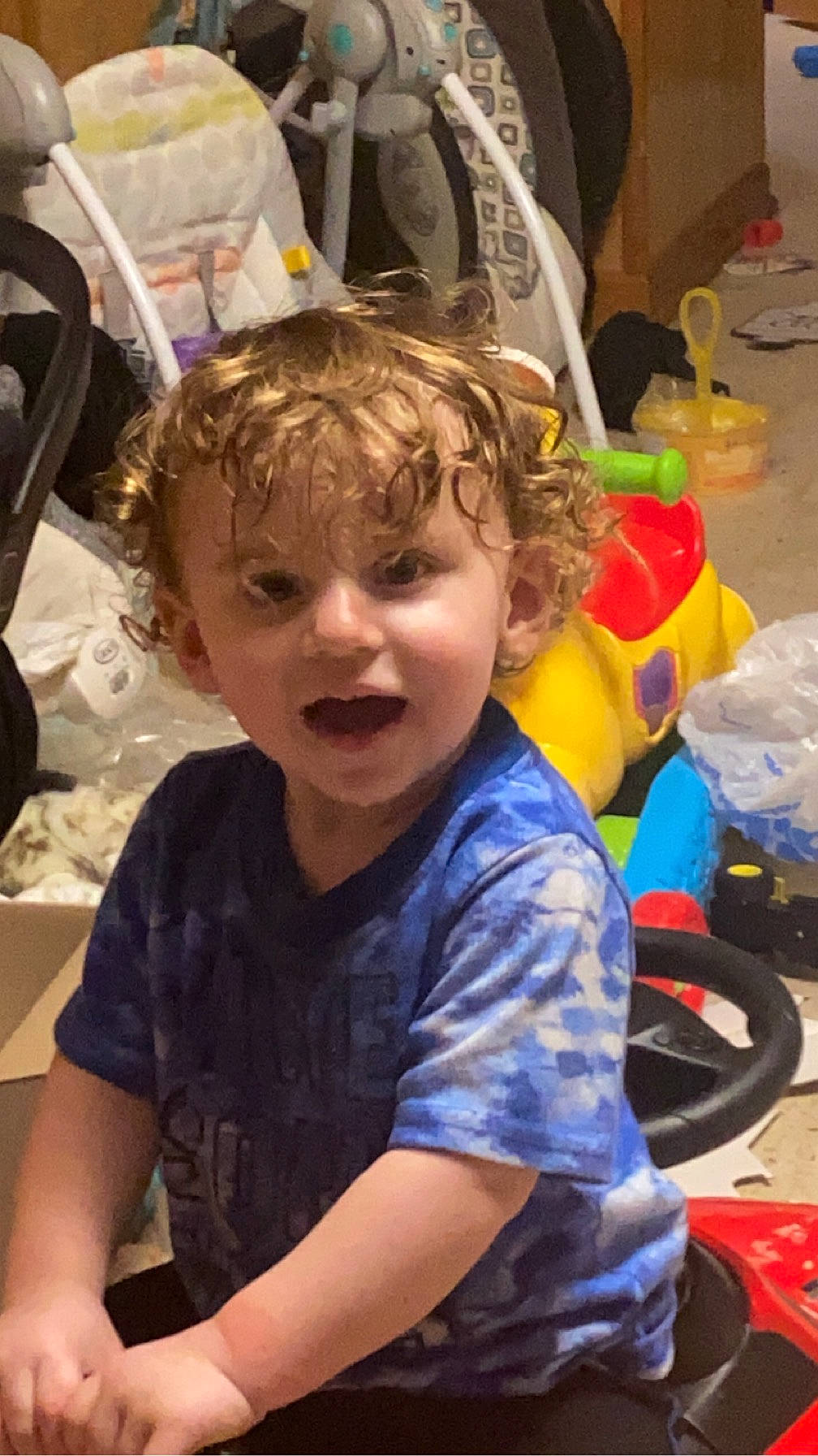 Jaylen is registered to the contest to win money with this photo: automotive_tire, bag, child, community, electric_blue, fun, hairstyle, happy, leisure, motor_vehicle, person, personal_protective_equipment, play, recreation, sitting, smile, t_shirt, tire, toddler, vacation