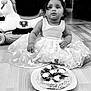 Agathe participe au concours pour gagner de l'argent avec cette photo : toddler, child, birthday, cake, dress, crown, toy, rocking_horse, floor, indoor, curious, sitting, black_and_white, portrait, celebration, butterfly_pattern, whipped_cream, fruit_topping, cute, party