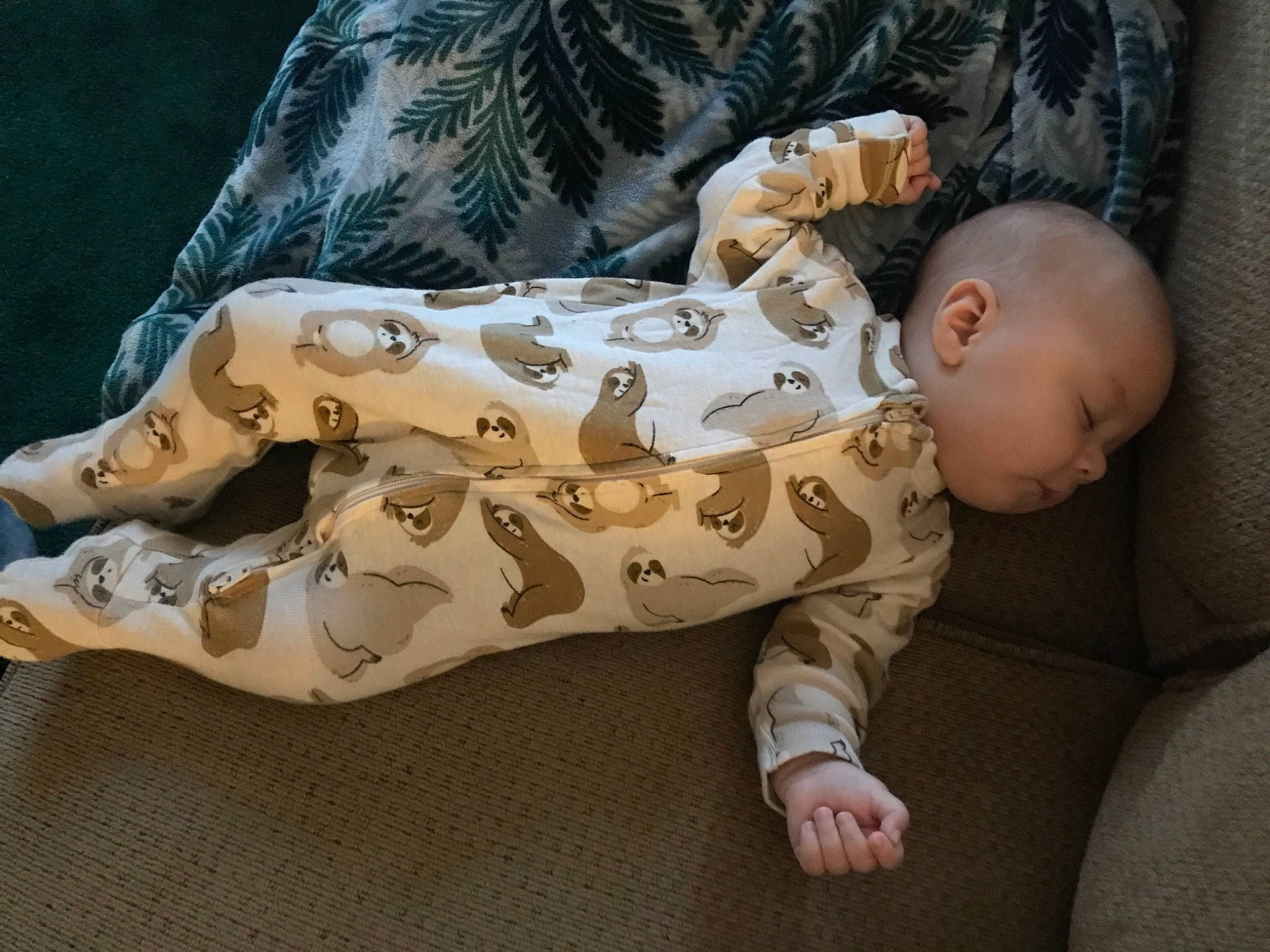 Harlan is registered to the contest to win money with this photo: baby, baby_sleeping, baby_toddler_clothing, barefoot, bedding, child, comfort, flooring, foot, fur, human_body, human_leg, knee, linens, pattern, person, sitting, sleeve, thigh, toddler