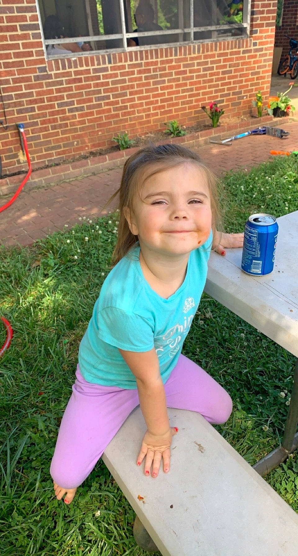 Indica is registered to the contest to win money with this photo: baby_toddler_clothing, brick, brickwork, child, electric_blue, fun, grass, grass_family, green, happy, joy, lawn, leisure, people_in_nature, person, plant, recreation, shorts, smile, summer