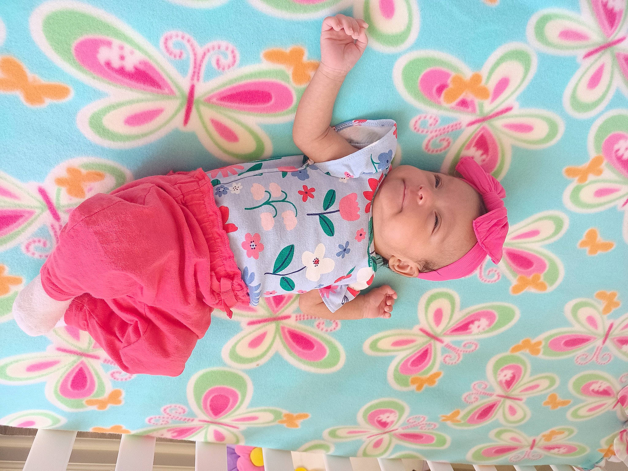 Jazelle is registered to the contest to win money with this photo: arm, baby, baby_products, baby_toddler_clothing, bedding, child, comfort, happy, headwear, linens, magenta, pattern, peach, person, pink, play, room, sleeve, t_shirt, textile