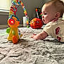 baby, toy, carpet, room, window, light, colorful, headphones, duck, floor, child, playing, indoor, soft, curious, crawling, orange, red, white, furniture