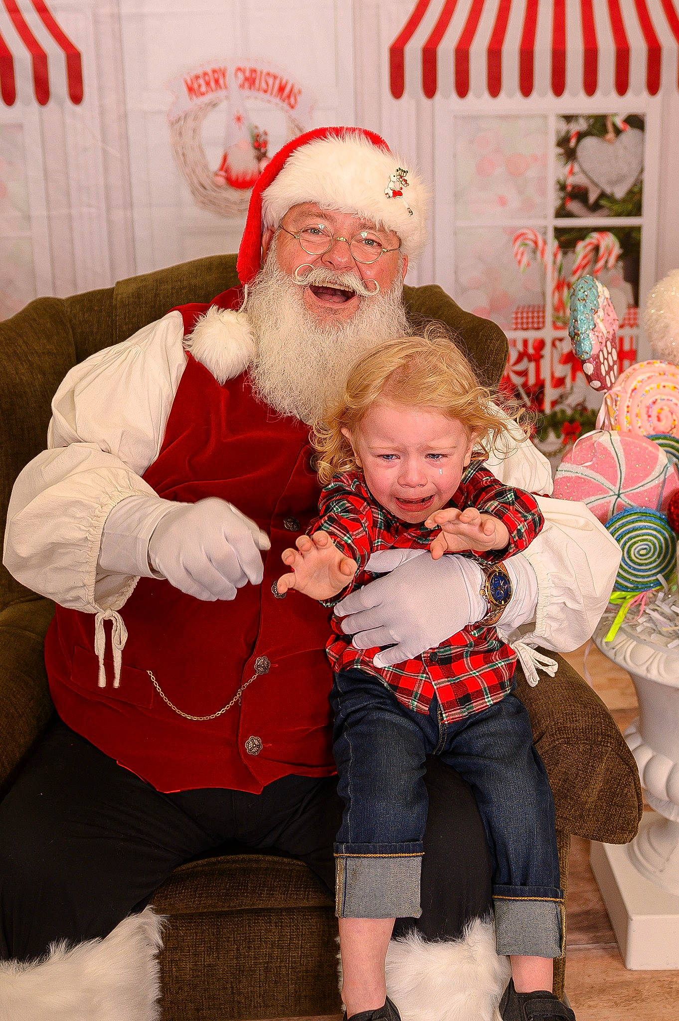 Jayce is registered to the contest to win money with this photo: baby, beard, child, christmas_eve, event, face, fictional_character, fun, happy, hat, head, headwear, holiday, joy, lap, person, red, santa_claus, sitting, smile