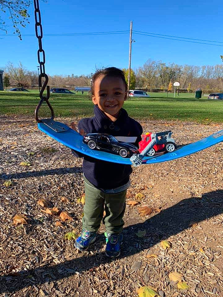 Prince is registered to the contest to win money with this photo: child, city, joy, outdoor_play_equipment, person, play, playground, public_space, recreation, smile