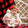 accessories, baby, blanket, bonnet, cap, clothing, costume, couch, face, furniture, hat, head, homedecor, linen, person, photography, portrait, quilt, tartan, toy