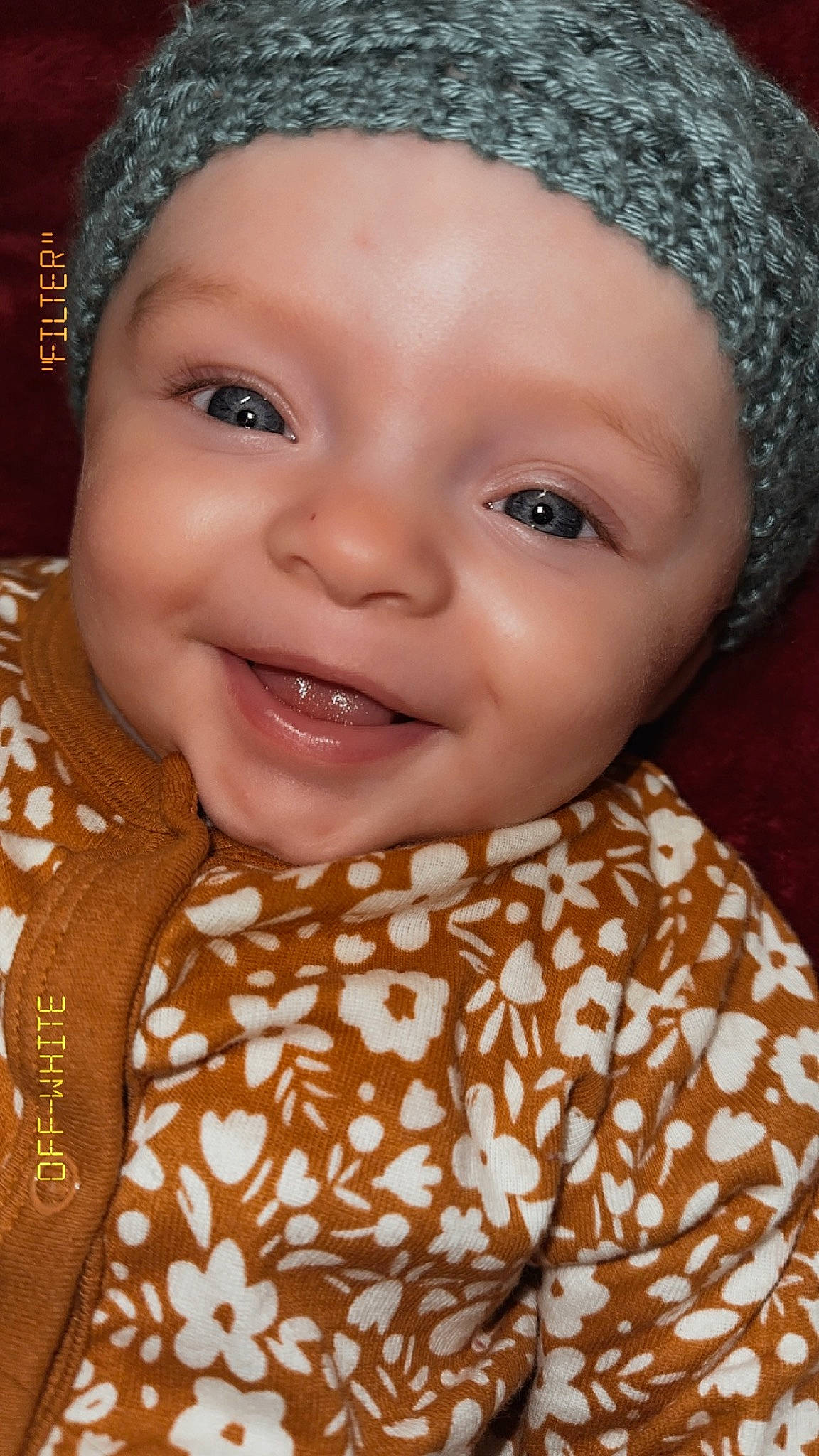 Octavia is registered to the contest to win money with this photo: baby, cap, cheek, chin, eye, eyebrow, forehead, happy, head, headgear, headwear, iris, lip, nose, organ, outerwear, person, pink, skin, sleeve