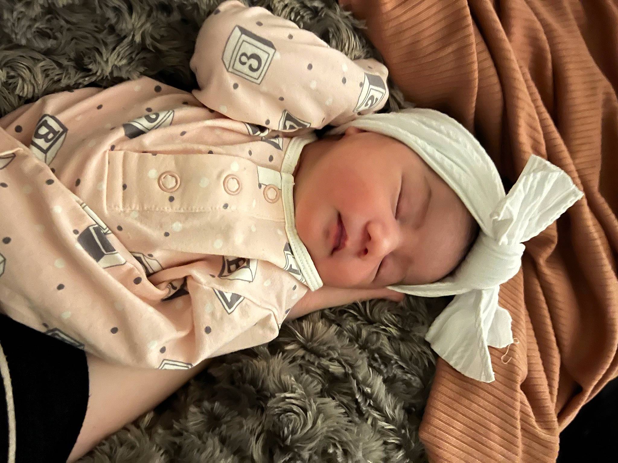 Athena is registered to the contest to win money with this photo: baby, baby_products, baby_sleeping, baby_toddler_clothing, bedtime, cheek, child, comfort, eye, headwear, linens, military_camouflage, nap, pattern, person, portrait_photography, room, sitting, sleep, sleeve