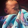 baby, sleeping, blanket, blue_blanket, cartoon_characters, face, infant, child, cozy, soft_texture, cute, peaceful, portrait, indoors, closeup, head, resting, warm, toddler, comfort