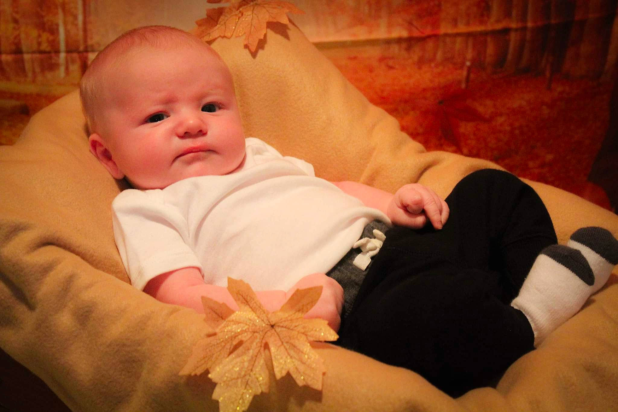 Kaysen is registered to the contest to win money with this photo: baby, baby_sleeping, baby_toddler_clothing, bedtime, cheek, child, comfort, finger, gesture, happy, human_body, linens, mouth, nose, orange, person, skin, textile, thumb, toddler