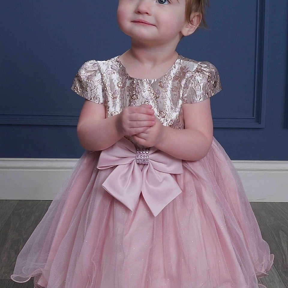 Kairi is registered to the contest to win money with this photo: child, clothing, costume, dress, eveningdress, face, fashion, female, formalwear, girl, gown, head, hosiery, person, photography, portrait, sitting, sleeve, sock, wood
