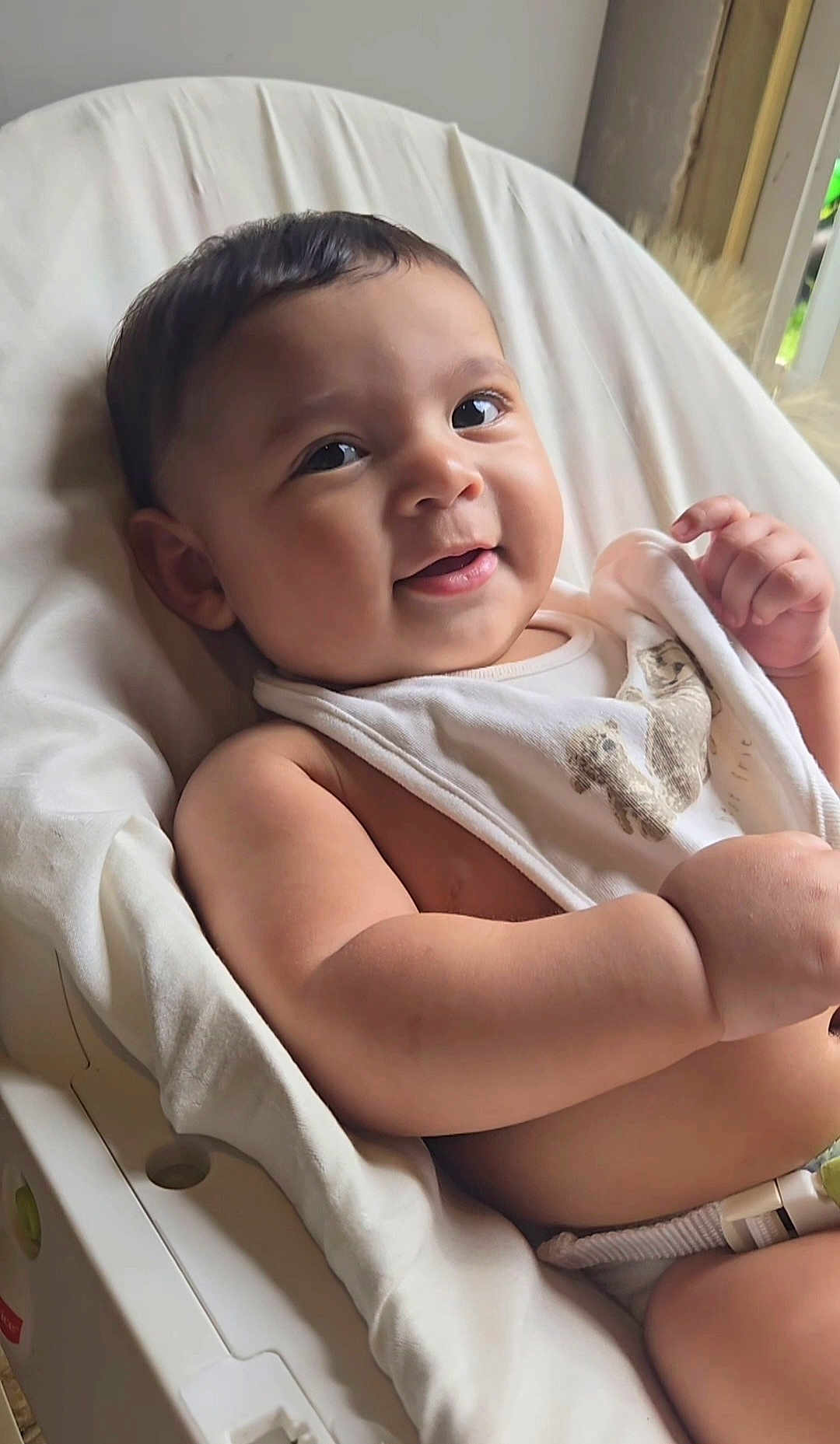 Fabian Rey joined the competition — help win amazing prizes! baby, child, smiling, face, arm, hand, cloth, bear_print, seat, cushion, white, indoor, window, natural_light, skin, closeup, cute, infant, happy, portrait
