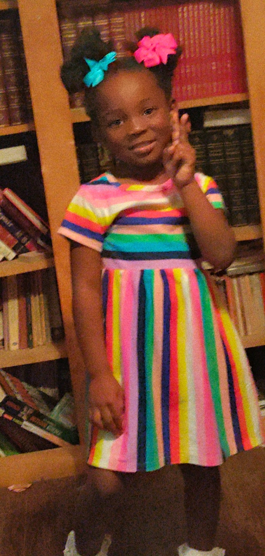 Gionna joined the competition — help win amazing prizes! bookcase, child, chin, day_dress, fashion_design, fun, happy, joy, magenta, one_piece_garment, pattern, person, publication, room, shelf, sleeve, standing, street_fashion, t_shirt, thigh