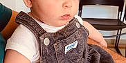 Aprile participe au concours pour gagner de l'argent avec cette photo : baby, child, denim, dress, overalls, white_shirt, person, indoor, arm, seated, curious, red_hair, skin, face, eyes, chair, blanket, human, cute, soft_lighting