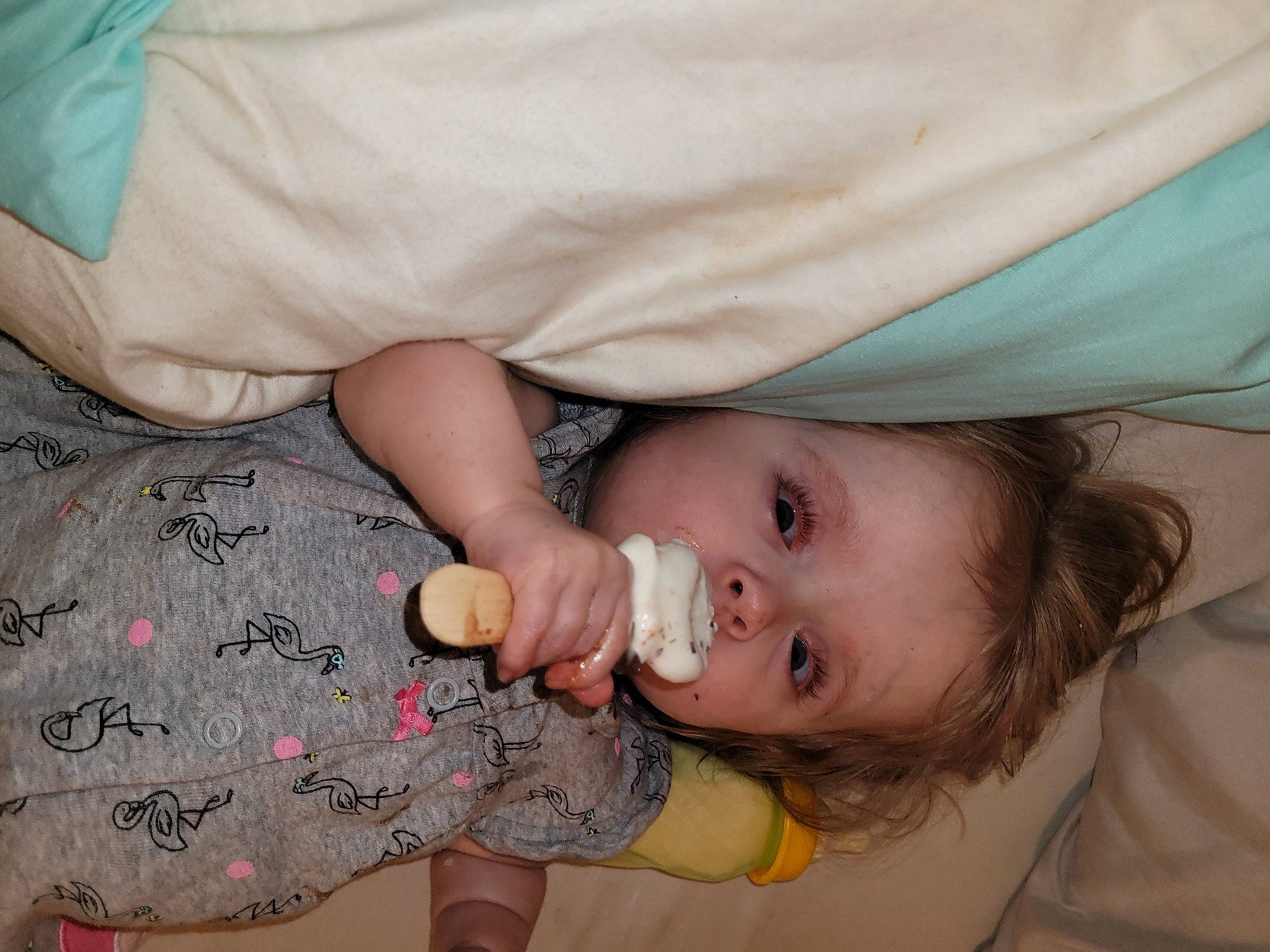 Bethany is registered to the contest to win money with this photo: baby, baby_toddler_clothing, cheek, dress, eye, eyelash, face, gesture, hand, happy, head, iris, joint, lip, mouth, neck, nose, person, skin, sleeve