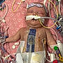 Roseanna is registered to the contest to win money with this photo: baby, bandages, child, critical_care, face, healthcare, heart_pattern, hospital, hospital_equipment, infant, intensive_care, medical, medical_tape, monitoring, patient, pink_blanket, respirator, sensors, sleeping, tubes