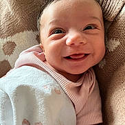 Tianna joined the competition — help win amazing prizes! baby, smiling, blanket, face, infant, cozy, closeup, cute, happy, child, pattern, soft, wrapped, indoors, skin, tongue, portrait, apparel, resting, young