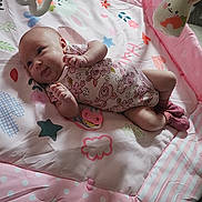 Ka'Lani Grace joined the competition — help win amazing prizes! baby, child, colorful, cute, decor, expression, face, footwear, hand, indoor, infant, lying_down, onesie, patterned, pink, playmat, playtime, socks, soft_toys, toy
