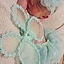 baby, blanket, child, closeup, cozy, cute, decorative, fabric, flower, headband, indoor, infant, lace, mint_green, peaceful, portrait, resting, sleeping, soft_texture, tutu