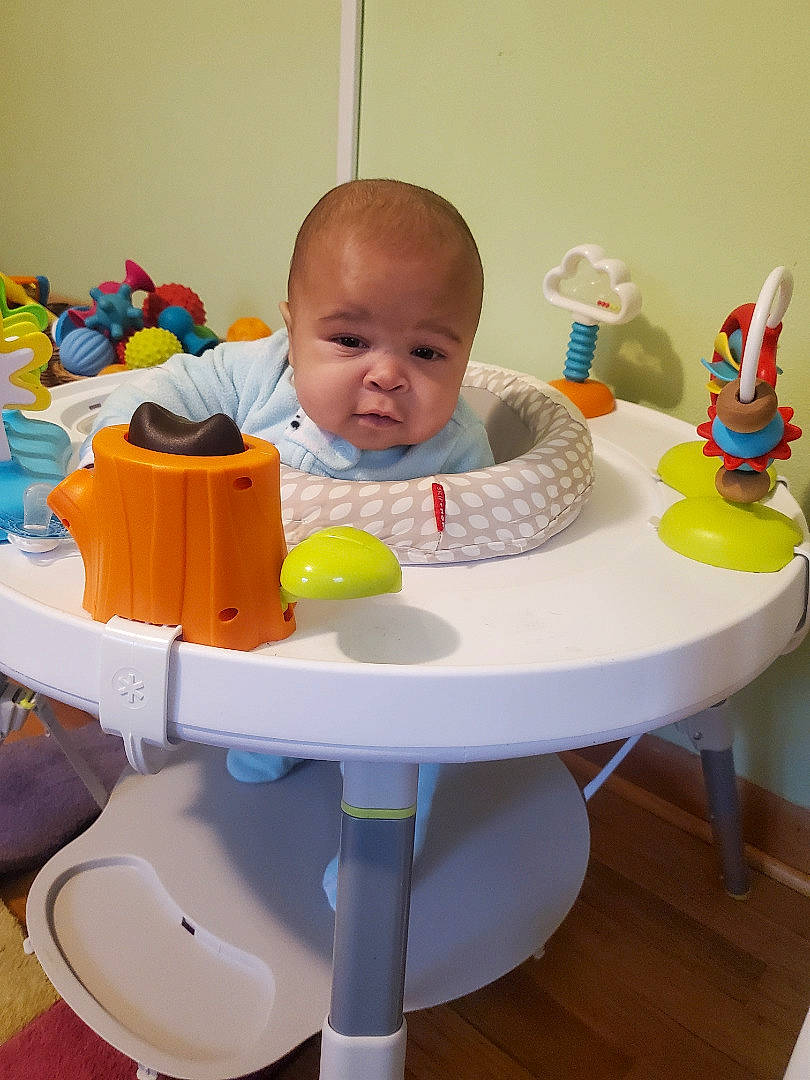 Kashton is registered to the contest to win money with this photo: baby, baby_playing_with_toys, baby_products, baby_toddler_clothing, baby_toys, chair, child, comfort, flooring, fun, leisure, outdoor_table, person, plastic, play, room, sharing, sitting, table, tableware