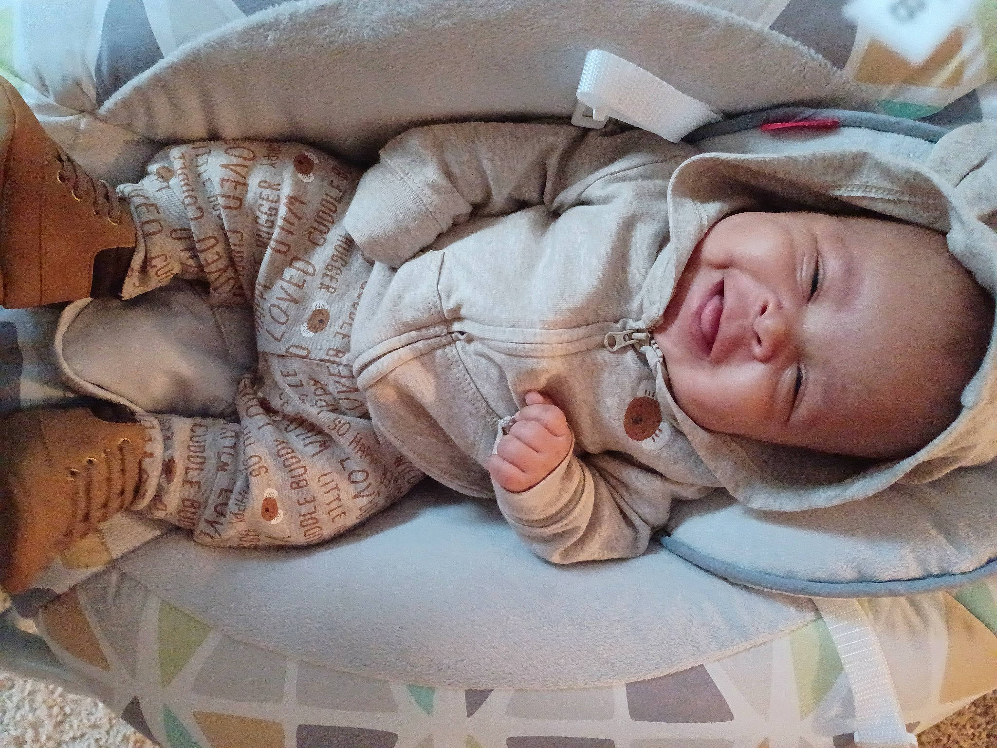 Kashton is registered to the contest to win money with this photo: baby, baby_toddler_clothing, cheek, child, comfort, eye, flooring, fur, head, linens, pattern, person, room, sitting, sleep, sleeve, smile, sunglasses, toddler, tree