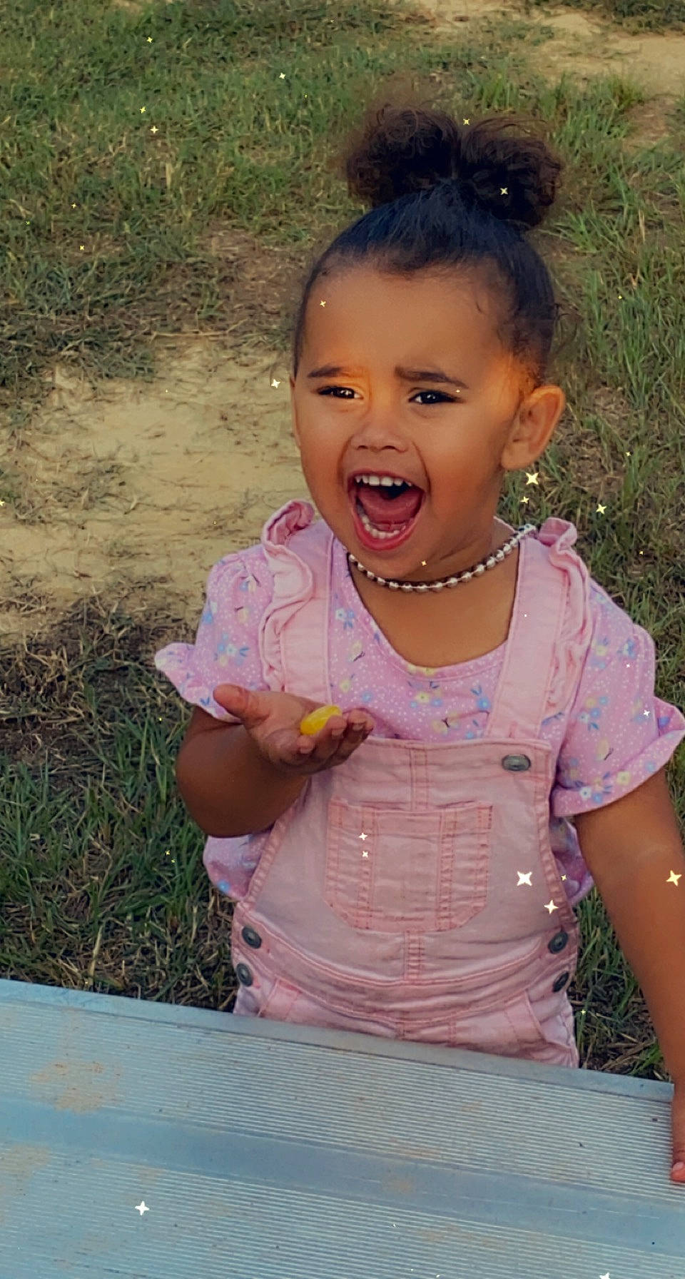 Ava is registered to the contest to win money with this photo: baby_toddler_clothing, cheek, chin, eyelash, fun, grass, happy, iris, jewellery, leisure, lip, mouth, neck, nose, people_in_nature, person, skin, smile, t_shirt, toddler