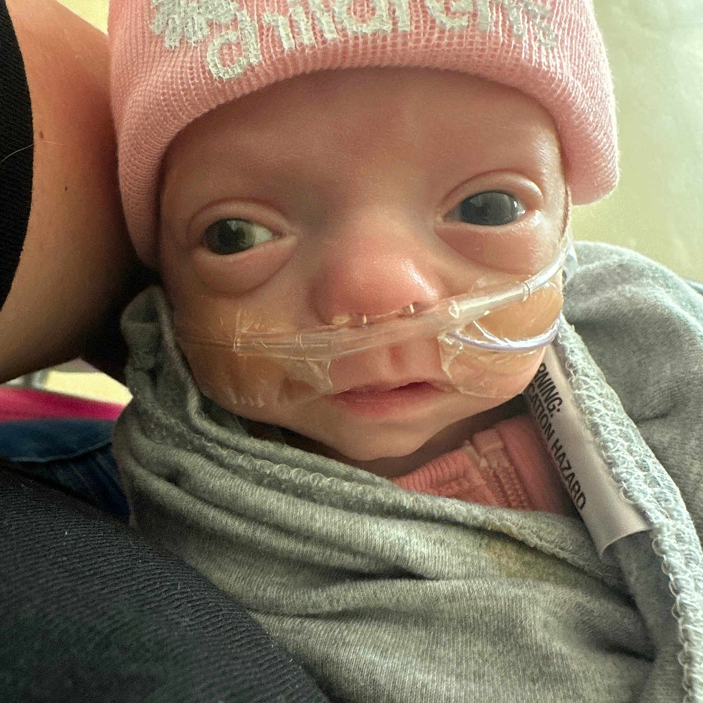 Everly is registered to the contest to win money with this photo: baby, bodypart, bonnet, cap, clothing, coat, face, glove, happy, hat, head, jacket, knitwear, newborn, person, photography, portrait, selfie, smile, sweater