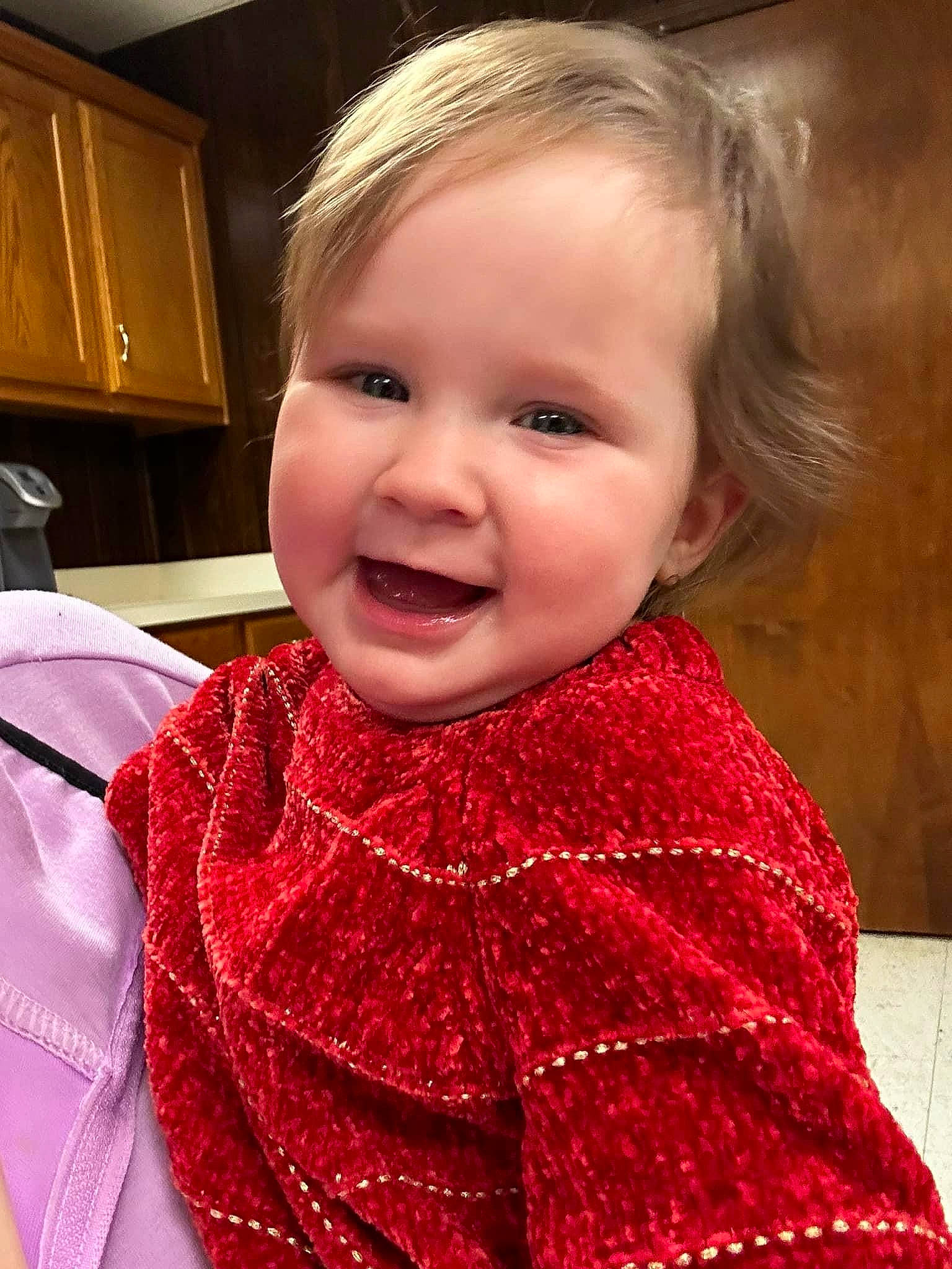Angelina is registered to the contest to win money with this photo: baby_toddler_clothing, cabinetry, cheek, child, eyelash, fashion_accessory, hair, happy, head, iris, joy, lip, magenta, pattern, person, pink, shawl, sleeve, smile, toddler