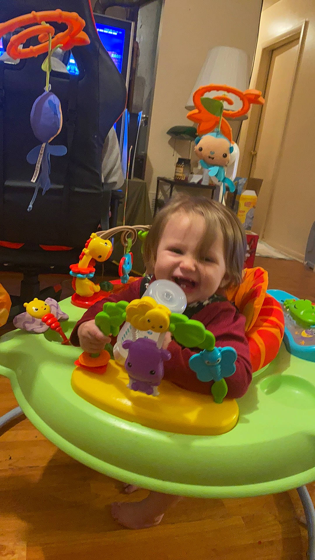 Peyton is registered to the contest to win money with this photo: baby, baby_playing_with_toys, baby_products, baby_toys, blue, child, event, fun, leisure, person, play, recreation, room, sharing, sitting, smile, stuffed_toy, table, toddler, toy