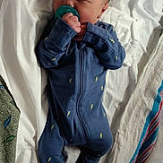 Aziel joined the competition — help win amazing prizes! newborn, baby, pacifier, blue_onesie, sleeping, blanket, towel, infant, cozy, bed, resting, cute, small, hands, face, head, person, soft, sleep, child