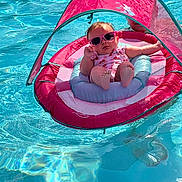 Meadow joined the competition — help win amazing prizes! baby, pool, float, sunglasses, water, pink, canopy, child, summer, relaxing, sunshine, infant, swimming_pool, leisure, cute, vacation, floating, outdoor, person, fun